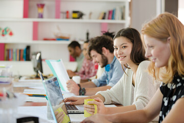 People working at conference table in office