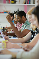 People working at conference table in office