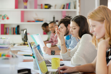 People working at conference table in office