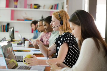 People working at conference table in office