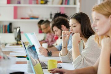 People working at conference table in office