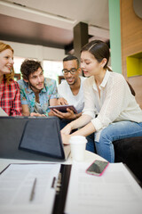 People working at laptop in office