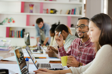People working at conference table in office