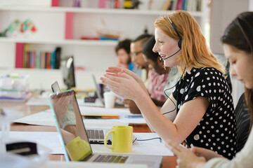People working at conference table in office