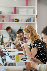 People working at conference table in office
