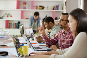 People working at conference table in office