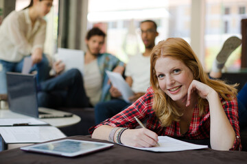 Woman writing in office