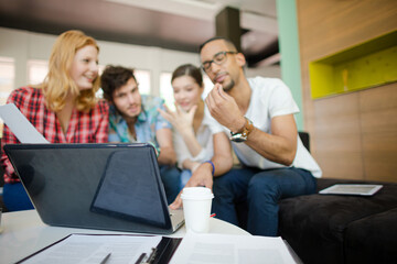 People working at laptop in office