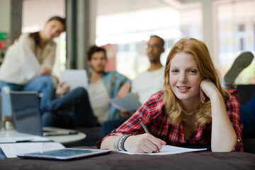 Woman writing in office