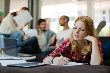 Woman writing in office