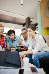 People working at laptop in office