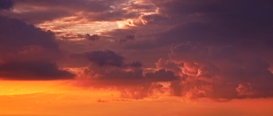 Fototapeta premium A dramatic sky with clouds during the sunset.