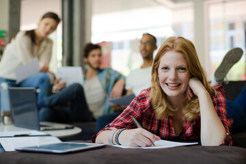 Woman writing in office
