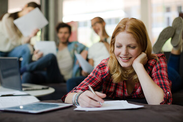 Woman writing in office