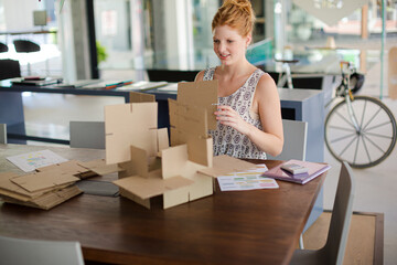 People building model together