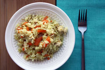 Flavorful pilaf of rice, carrots and chicken.