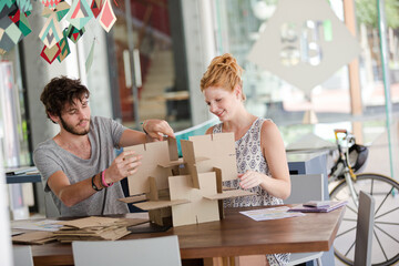 People building model together