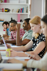 People working at conference table in office