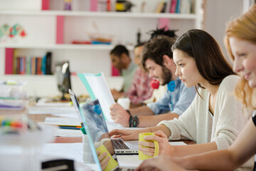 People working at conference table in office