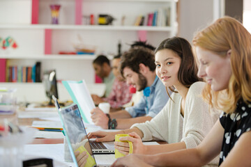 People working at conference table in office