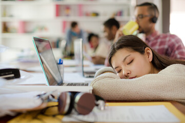 Woman sleeping at conference table