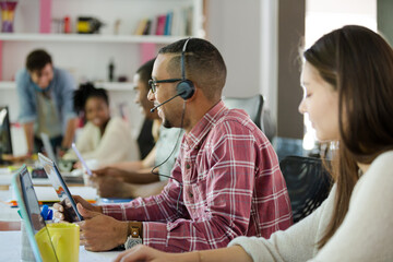 People working at conference table in office