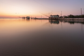 Panoramic view of fishing huts at sunrise
