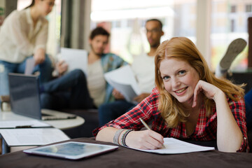 Woman writing in office