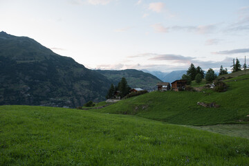 The village of “Grächen” in Valais in Switzerland with its typical houses, after sunset.