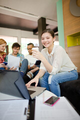 Woman drinking coffee in office