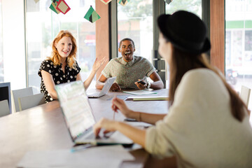 People working at conference table in office