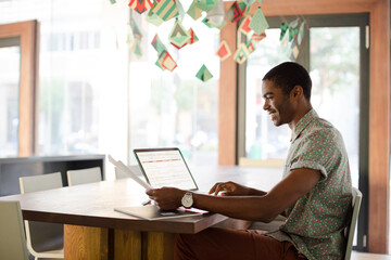 Man working on laptop at office