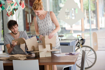 People building model together