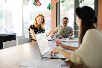 People working at conference table in office