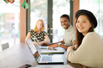 People working at conference table in office