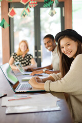 People working at conference table in office