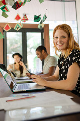 Woman working at conference table in office