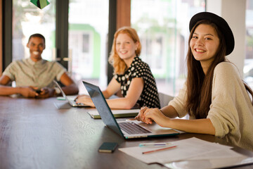 People working at conference table in office