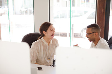 People high fiving in office