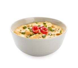 Bowl of tasty chicken curry on white background