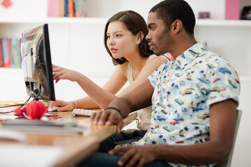 People working on computer in office
