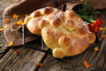 Bread of the dead on wooden background. Celebration of Mexico's Day of the Dead (El Dia de Muertos)