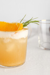 Glass of tasty whiskey sour cocktail on white background