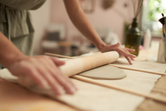 Female Potter Rolling Clay Slab