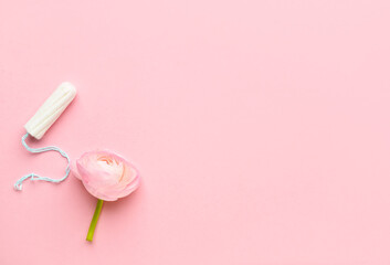 Obraz premium Tampon and flower on color background