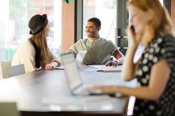 Woman working at conference table in office