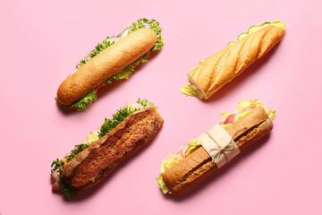 Tasty sandwiches on color background