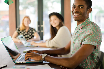 People working at conference table in office