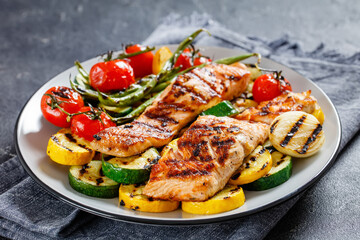 grilled salmon and vegetables on a plate