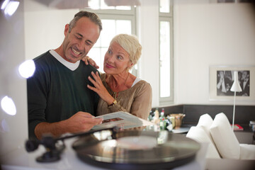 Older couple listening to vinyl records